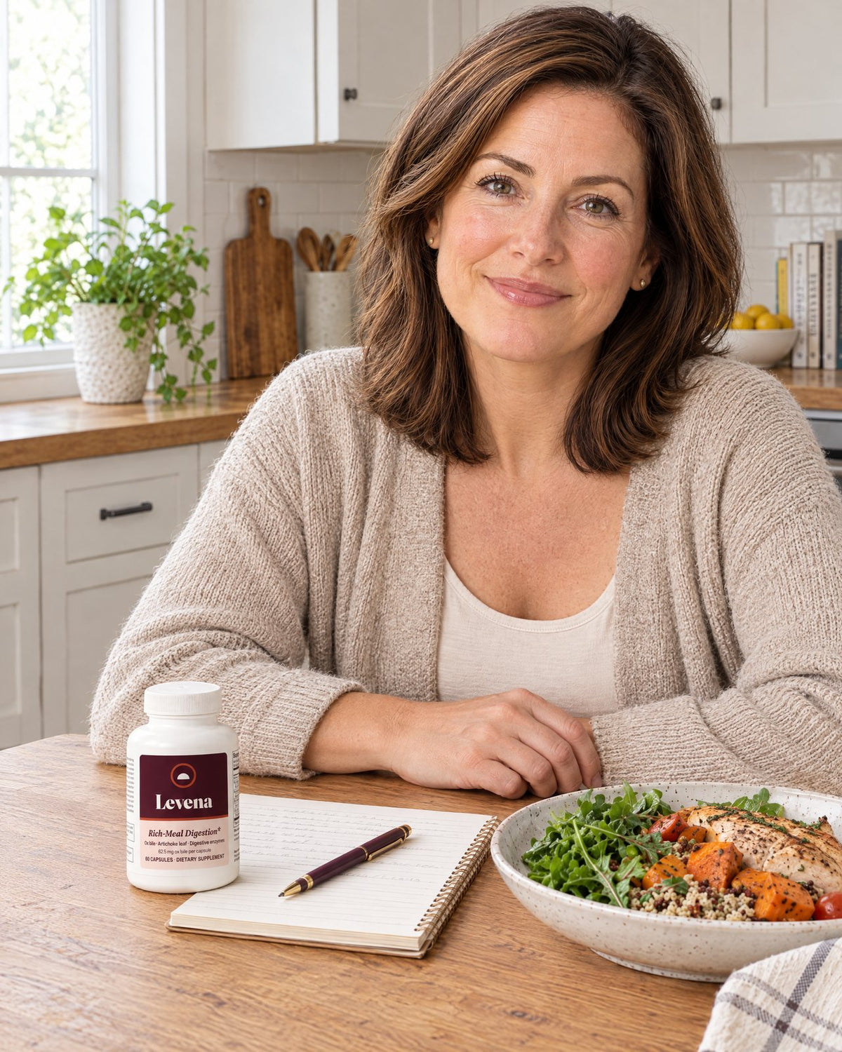 Our registered dietitian at a kitchen table with a Levena bottle and a notebook