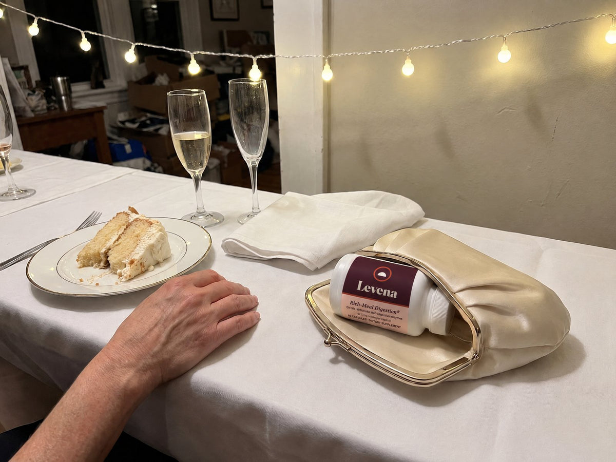 A wedding reception table, the Levena bottle in a clutch bag