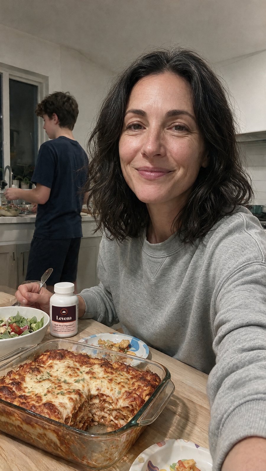 Michelle, 47, at her kitchen island with a lasagna
